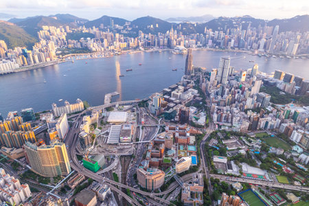 City landscape of the famous travel landmark, aerial view of Hong Kong, Victoria Harbour, eveing...