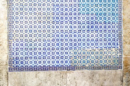 Exterior wall of a residential building with traditional portuguese tiles in the Bairro Alto district in the old town of Lisbon, Portugalの写真素材