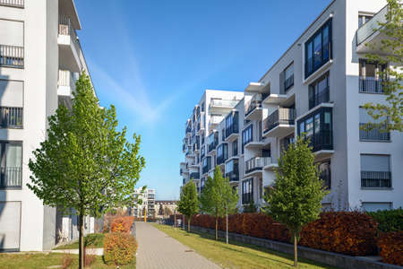 Cityscape of a residential area with modern apartment buildings, new green urban landscape in the cityの写真素材