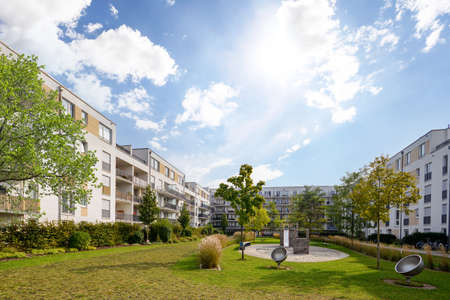 Cityscape of a residential area with modern apartment buildings, new green urban landscape in the...
