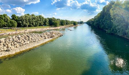 Riverside in Munich with bridge Wittelsbacherbrücke across the Isar River and view to museum...
