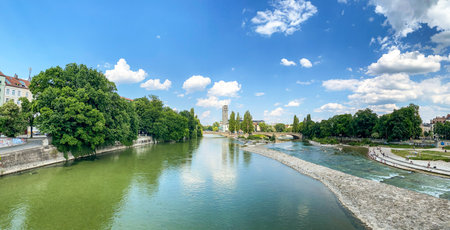 Riverside in Munich with bridge "Wittelsbacherbrücke" across the Isar River and view to museum "Deutsches Museum" in summer, Bavaria Germany Europeの写真素材