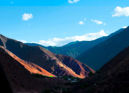 The sun shines on the hillsideの写真素材