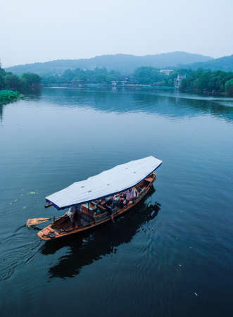 tourist in boat at Hangzhou West Lake のeditorial素材