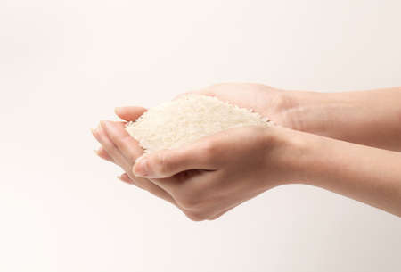 Hand holding riceの写真素材