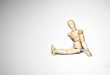 Puppet sitting on the floor の写真素材