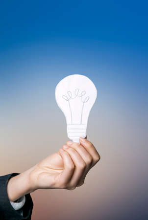Holding light bulbsの写真素材