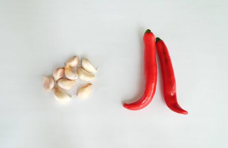 Red chili and garlic on white backgroundの写真素材