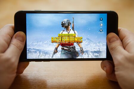 Moscow / Russia - February 24, 2019: loading pubg game on a black smartphone in male handsのeditorial素材
