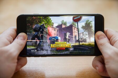 Moscow / Russia - February 24, 2019: loading pubg game on a black smartphone in male handsのeditorial素材