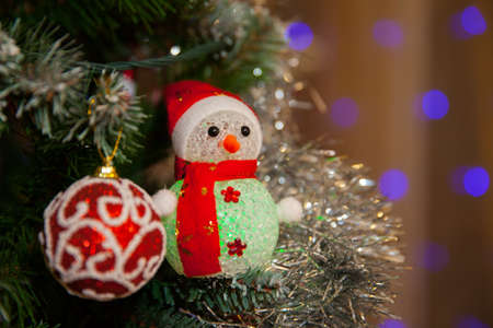 toy snowman on the treeの写真素材