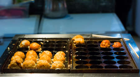 Cooking of Takoyaki one of the most popular foodの写真素材