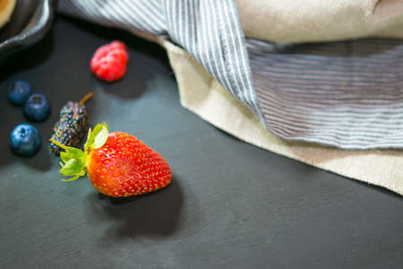 Selective focus strawberry on wood backgroundの写真素材