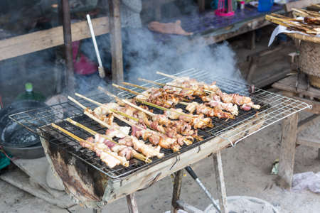 Pork grilled on charcoal (Thai style food)の写真素材