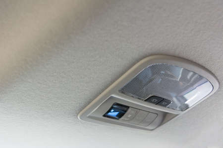 Car ceiling lamp and switch air for backgroundの写真素材