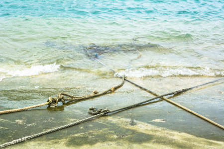 White Robe of Anchor on the cement beachの写真素材