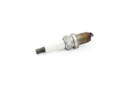Old spark plug isolated on the whiteの写真素材