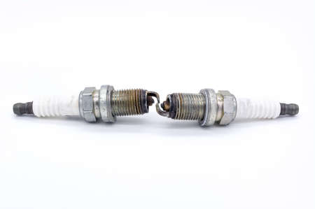 Old spark plug isolated on the whiteの写真素材