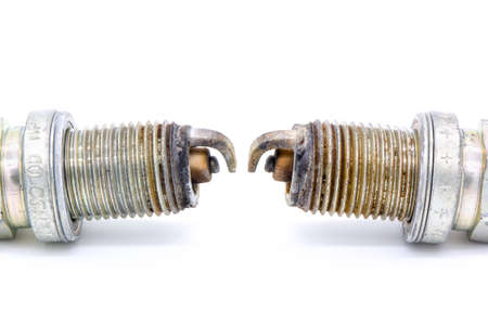 Old spark plug isolated on the whiteの写真素材