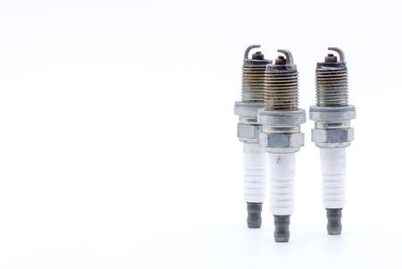 Old spark plug isolated on the whiteの写真素材