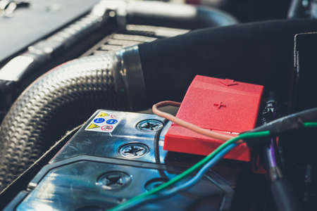 Clese up battery charging cables transferring power to a dead batteryの写真素材
