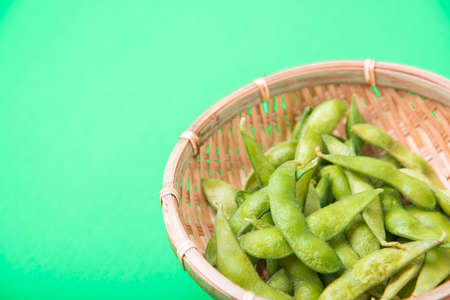 edamame with green backgroundの写真素材