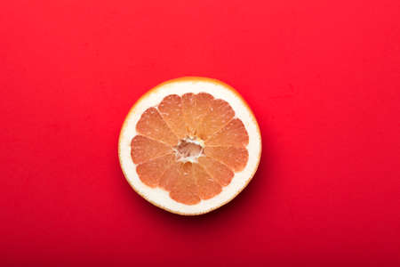 grapefruit with red background