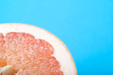 grapefruit with blue backgroundの写真素材