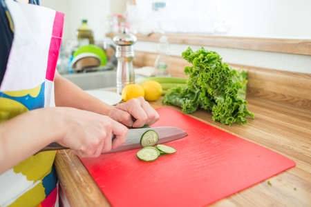 cutting cucumberの写真素材