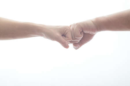 male and female doing fist bumpの写真素材