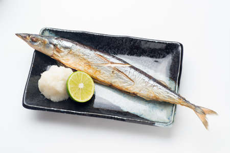 grilled sanma with daikon oroshi and sudachi citrusの写真素材