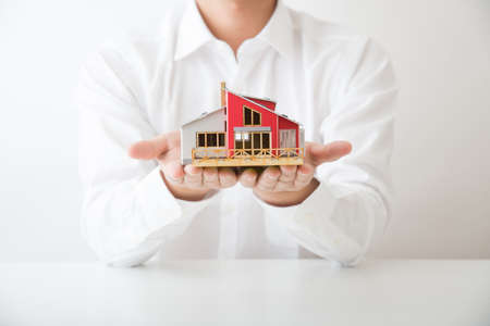 man holding house modelの写真素材