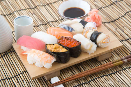 nigiri sushi on wooden boardの写真素材