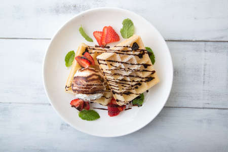 ice cream on waffle with strawberyyの写真素材