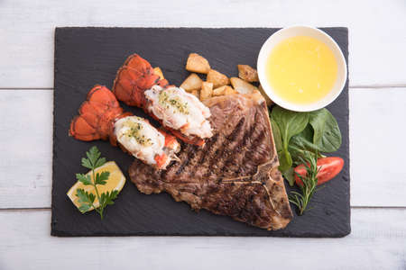 grilled lobster tail and T bone steakの写真素材