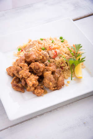 orange chicken with fried riceの写真素材
