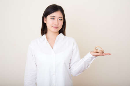 model car in young asian woman's handsの写真素材