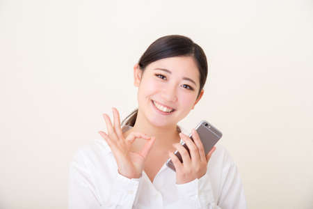 young asian woman using smart phoneの写真素材