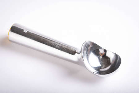 isolated ice cream scooper on white backgroundの写真素材