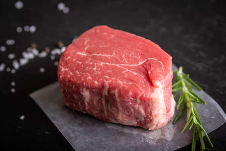 raw fillet mignon with rosemarry, salt and pepperの写真素材