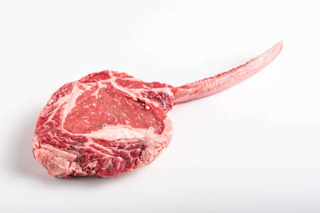 isolated tomahawk ribeye steak on white backgroundの写真素材