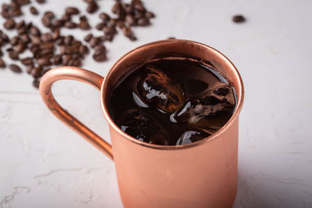 cold brewed coffee in copper mugの写真素材
