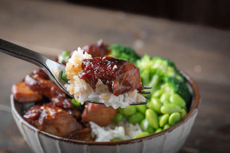 teriyaki chicken rice bowl with broccoli and edamameの写真素材