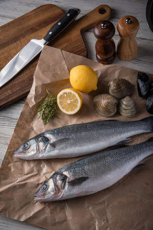 fresh branzini, european sea bass,  with clam and mussle