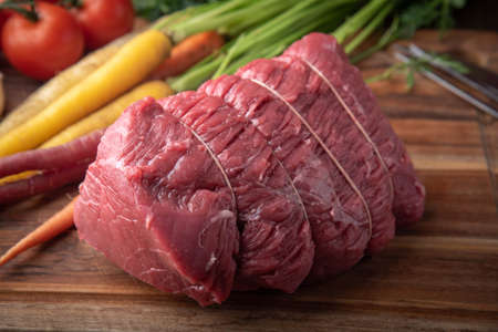 tied top round beef for roast beef with vegetable