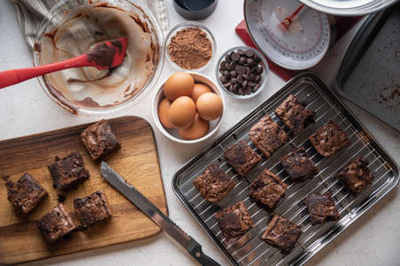 chocolate brownies with ingredients and baking tools