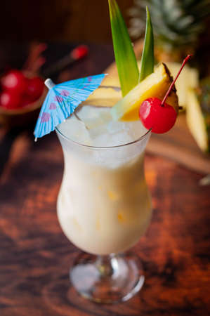 authentic pina colada cocktail with pineapple background