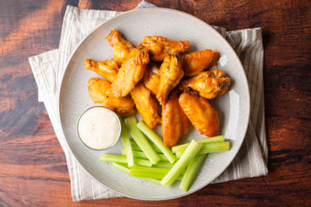 buffalo wings with celery and ranch dressingの写真素材