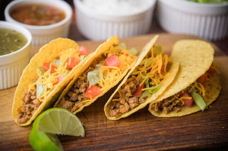 hard shell taco on wooden cutting boardの写真素材