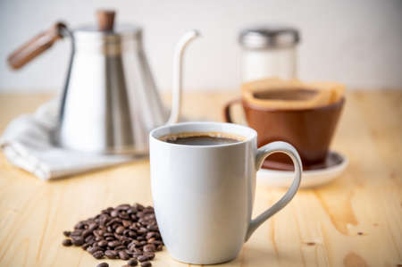 dripping coffee on wooden kitchen table